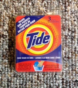 Mini Tide packets for laundry in the sink.