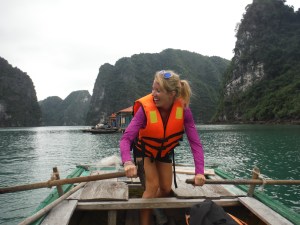 Attempting to row the bamboo boat.