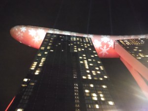 A 56 story hotel with a "boat" patio an pool on top.