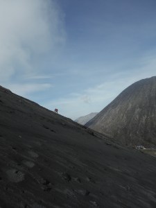 Hobo M hiking through the sand.